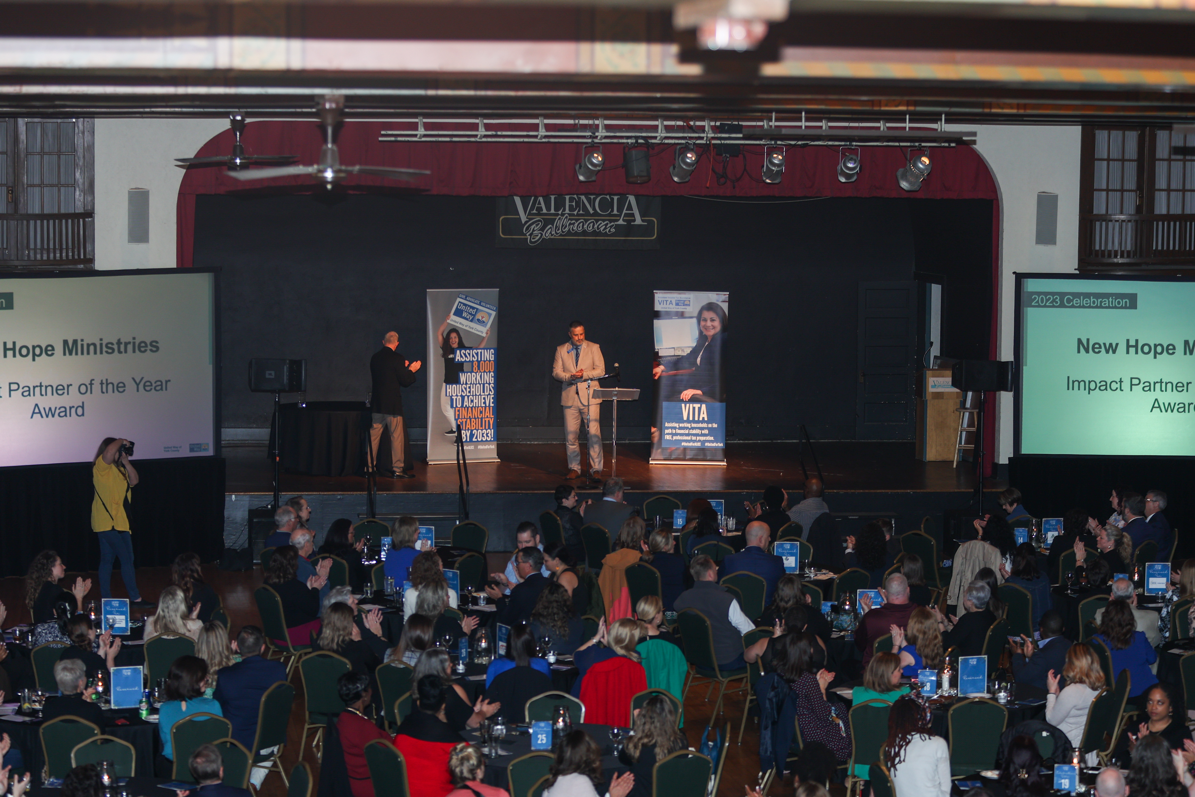 room full of people at an award event.