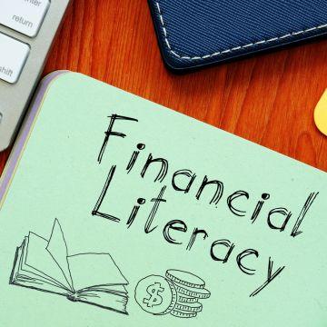 The words "Financial Literacy" written on a piece of paper