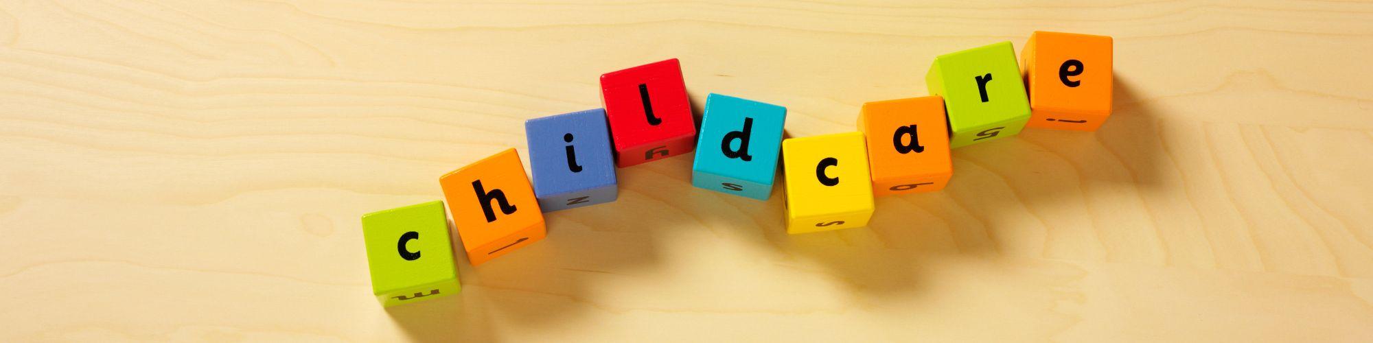 Building blocks with letters spelling the word "childcare"